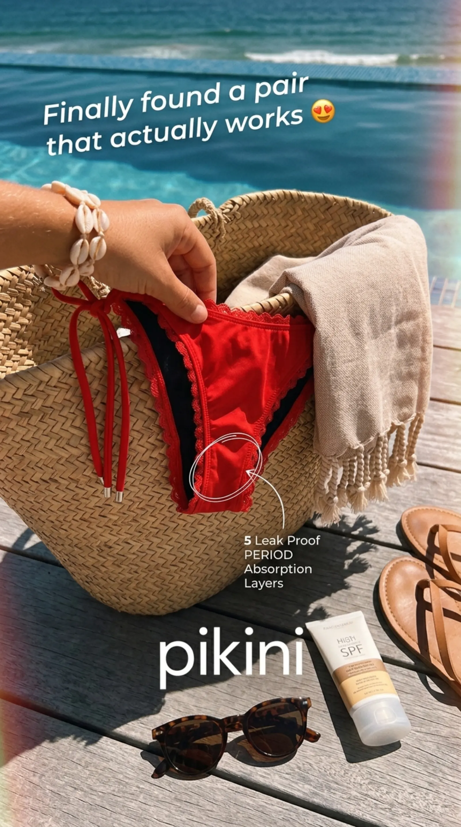 pikini red set in a beach bag with sunglasses, sandals, and SPF